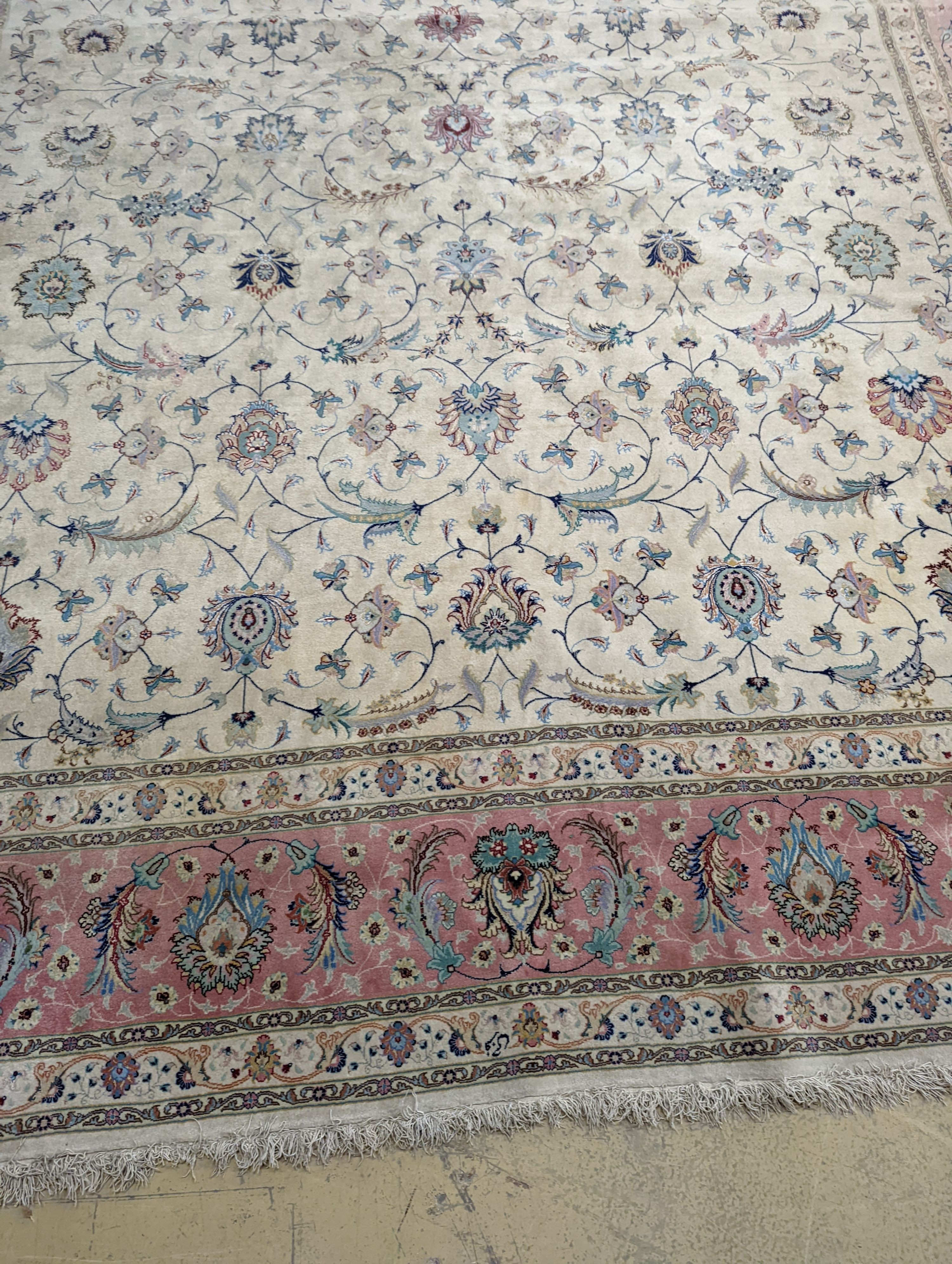 A Persian Tabriz ivory ground carpet, 410 x 300